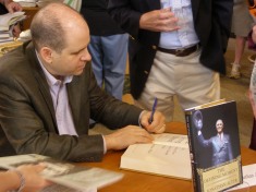 Political commentator and historian Jonathan Alter signs copies of his book "The Defining Moment" at the 2006 Reading Festival.